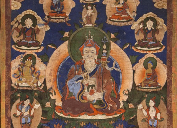 Tibetan scroll painting - a traditionally illustrated seated buddhist monk figure surrounded by buddhist deities  